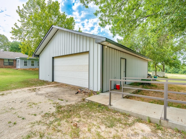 garage featuring a yard