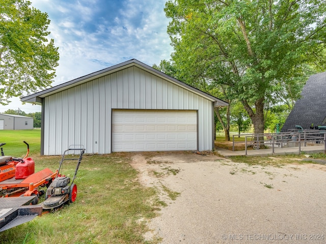 garage featuring a lawn