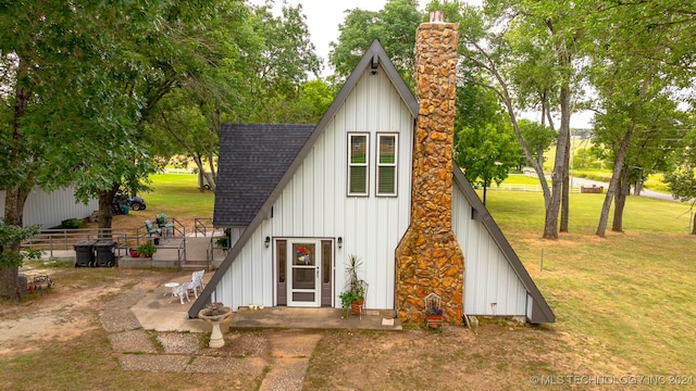 view of outdoor structure with a lawn