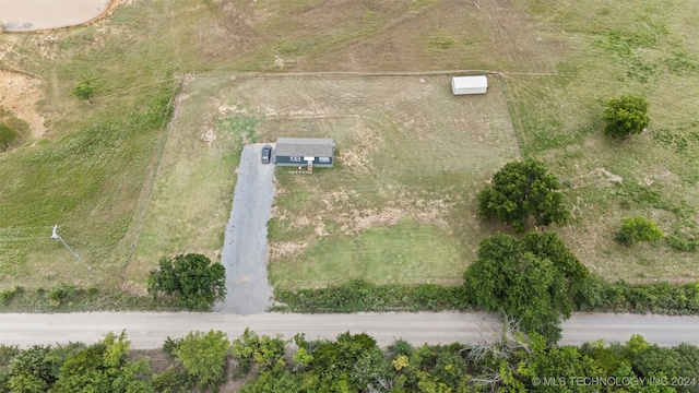 birds eye view of property with a rural view