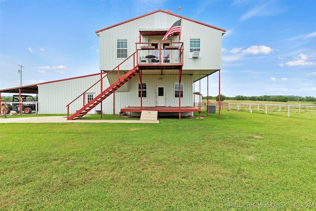 exterior space featuring cooling unit, a yard, and a deck