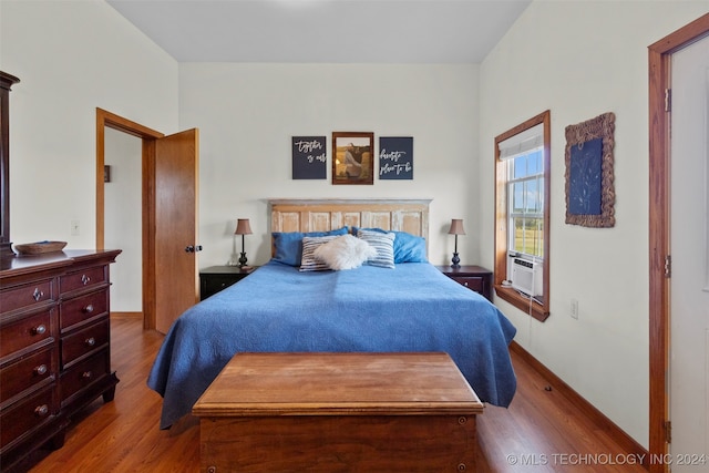 bedroom with hardwood / wood-style floors