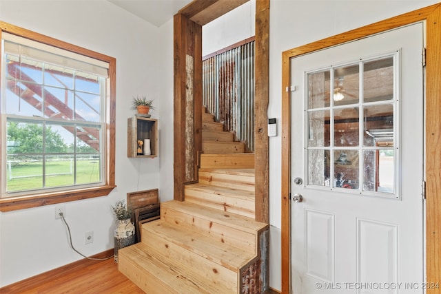 staircase featuring hardwood / wood-style flooring