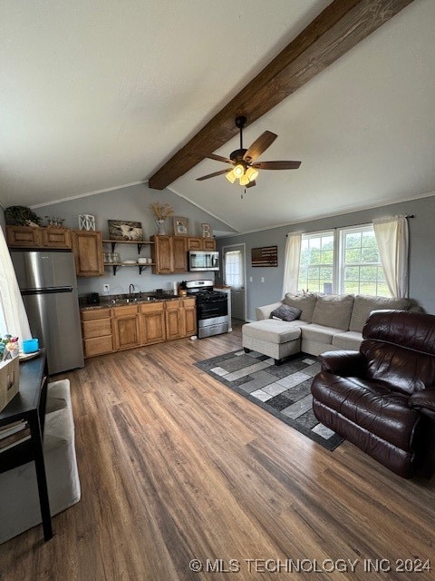 living room featuring ceiling fan, sink, lofted ceiling with beams, and wood-type flooring