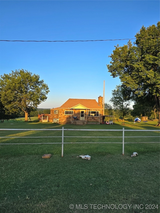 view of home's community with a yard