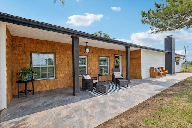 rear view of property featuring a patio