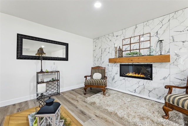 living room with tile walls and wood-type flooring