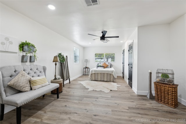 bedroom featuring ceiling fan and light hardwood / wood-style flooring