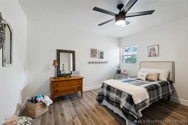 bedroom featuring hardwood / wood-style flooring and ceiling fan