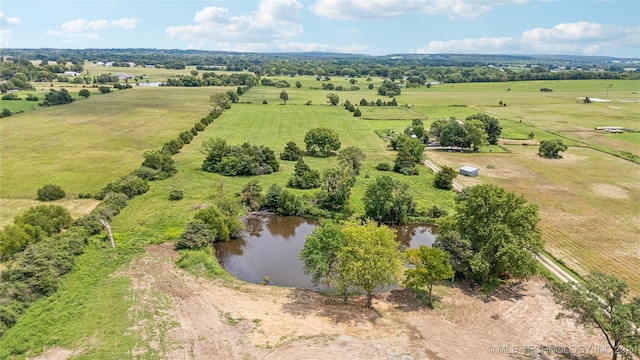 drone / aerial view featuring a water view and a rural view