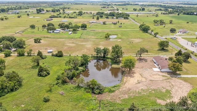 aerial view with a water view and a rural view