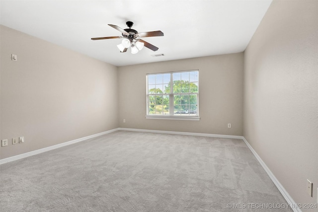 unfurnished room featuring ceiling fan and carpet floors