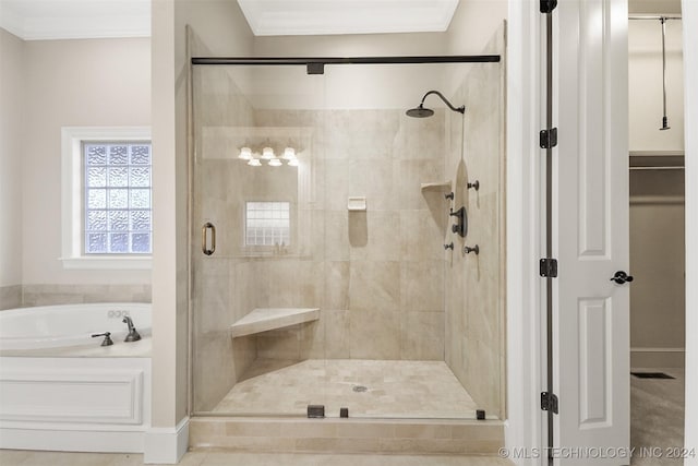 bathroom featuring plus walk in shower and ornamental molding