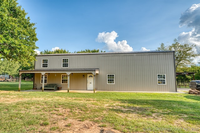 view of front of home with a front lawn and a patio area