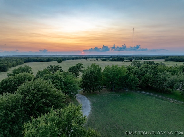 aerial view at dusk featuring a rural view