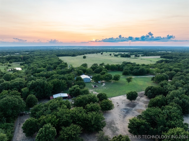 aerial view at dusk with a rural view