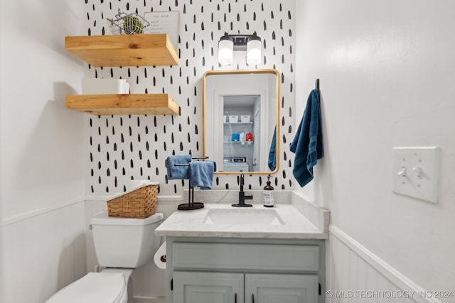 bathroom with vanity and toilet