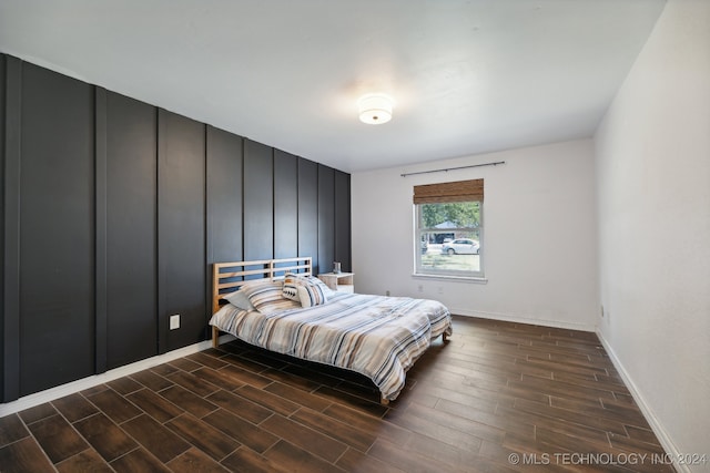 bedroom featuring dark wood-type flooring