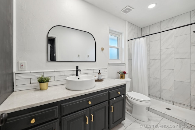 bathroom with decorative backsplash, tile patterned floors, toilet, vanity, and curtained shower