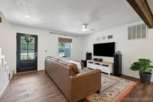 living room featuring dark hardwood / wood-style floors and ceiling fan