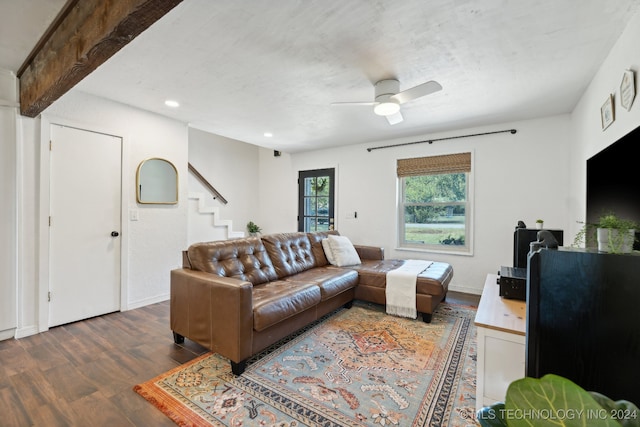 living room featuring beamed ceiling, ceiling fan, and hardwood / wood-style floors