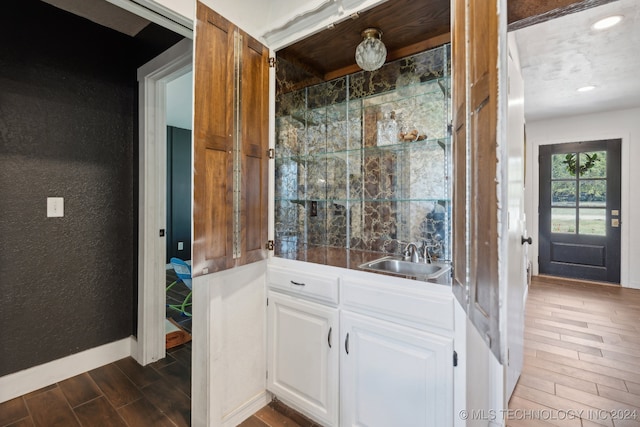 bathroom featuring hardwood / wood-style flooring and vanity