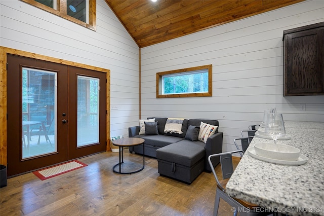 living room with french doors, wood ceiling, vaulted ceiling, and hardwood / wood-style flooring