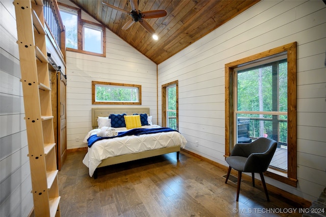 bedroom with multiple windows, wooden walls, wooden ceiling, and dark hardwood / wood-style flooring