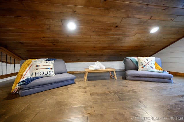 sitting room with wood-type flooring, lofted ceiling, wooden ceiling, and wooden walls