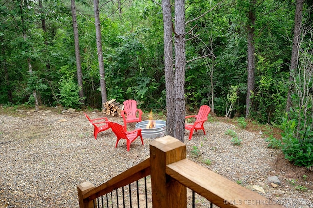 view of yard with a fire pit