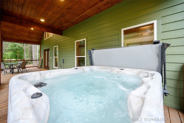 view of patio with a wooden deck and a hot tub