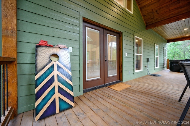 wooden terrace featuring french doors