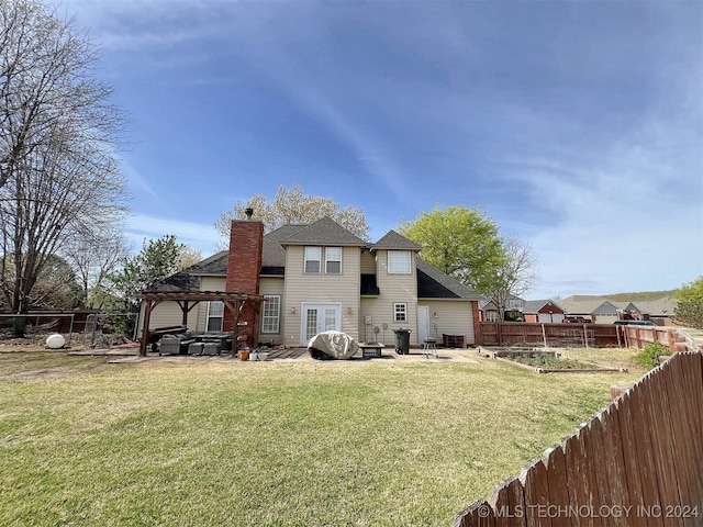 back of property featuring a patio, a gazebo, and a yard