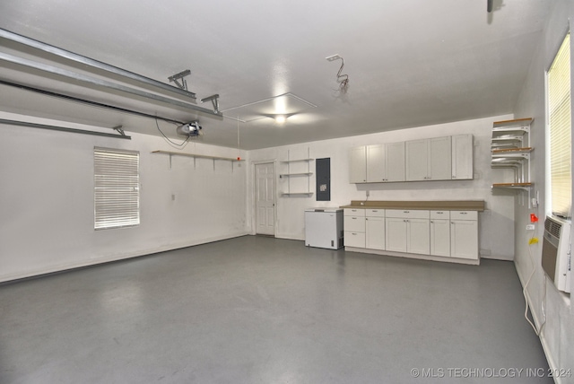 garage featuring a garage door opener and electric panel