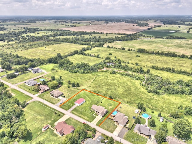 aerial view with a water view and a rural view