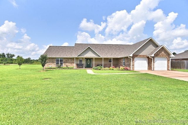 ranch-style house featuring a garage and a front yard