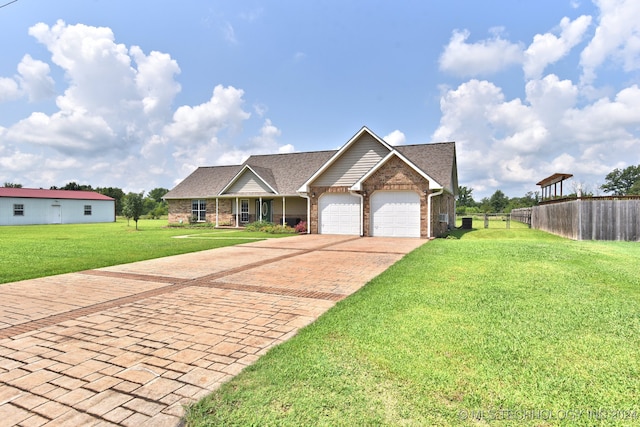 view of front of property with a garage and a front yard