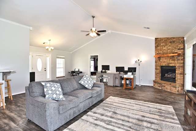 living room featuring vaulted ceiling, dark hardwood / wood-style floors, a fireplace, ceiling fan, and crown molding