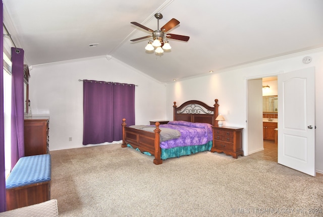 carpeted bedroom featuring crown molding, vaulted ceiling, and ceiling fan