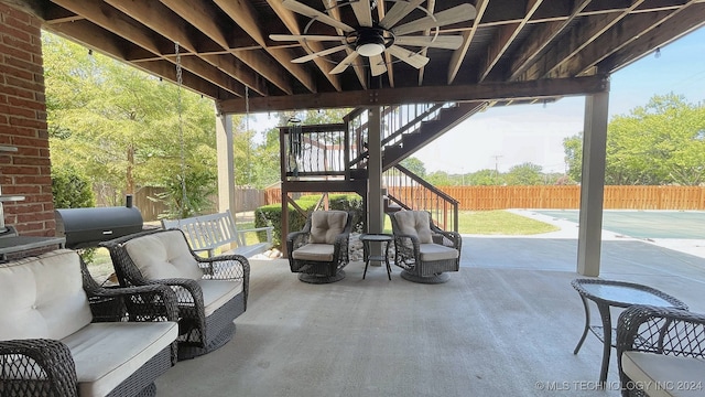 view of patio featuring ceiling fan