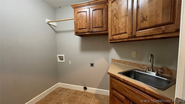 laundry room featuring hookup for an electric dryer, washer hookup, cabinets, sink, and tile patterned flooring