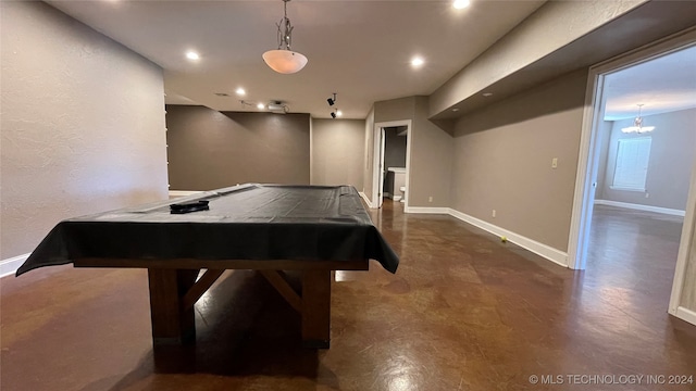 game room featuring billiards and a chandelier