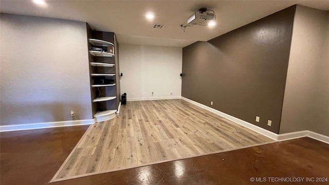 unfurnished room featuring hardwood / wood-style floors