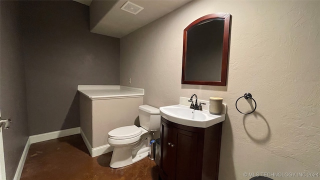 bathroom featuring vanity and toilet