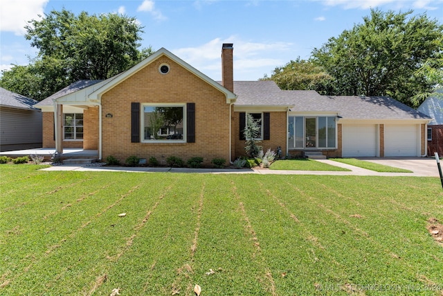 ranch-style home with a garage and a front lawn