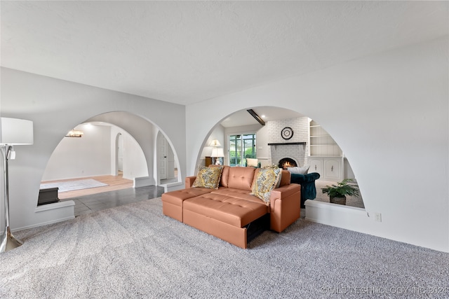 interior space featuring a fireplace and brick wall