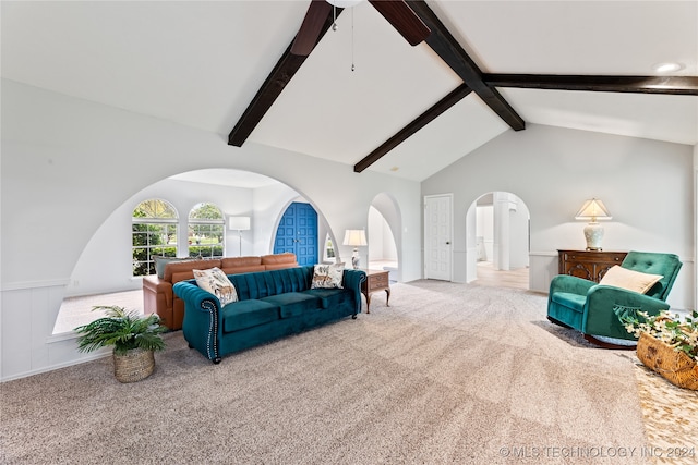 living room with light carpet and vaulted ceiling with beams