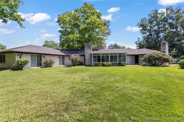 ranch-style home with a front yard