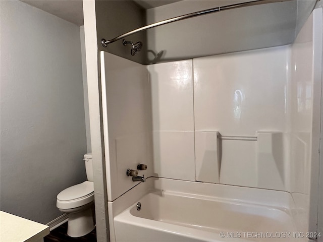 full bathroom featuring toilet, vanity, and shower / washtub combination