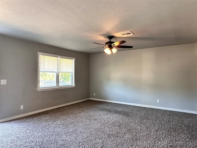 unfurnished room featuring carpet, a textured ceiling, and ceiling fan